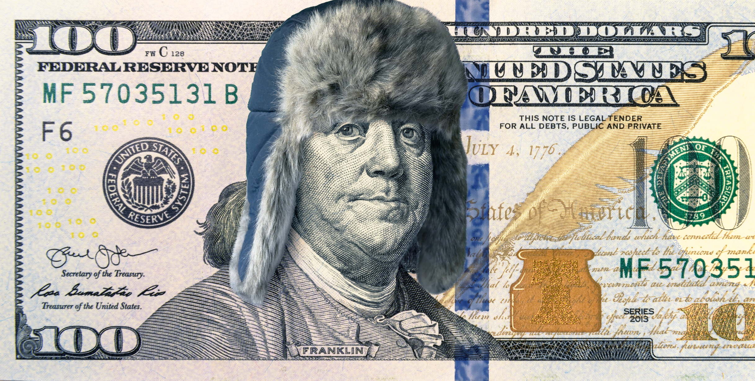 hundred dollar bill with Ben Franklin wearing winter hat