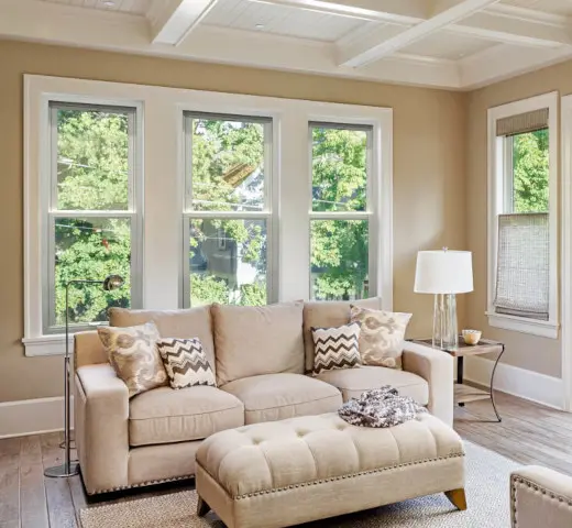 cozy living room with large windows daylight