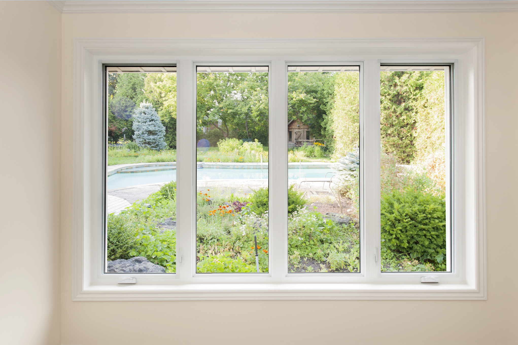 looking through casement window to backyard pool